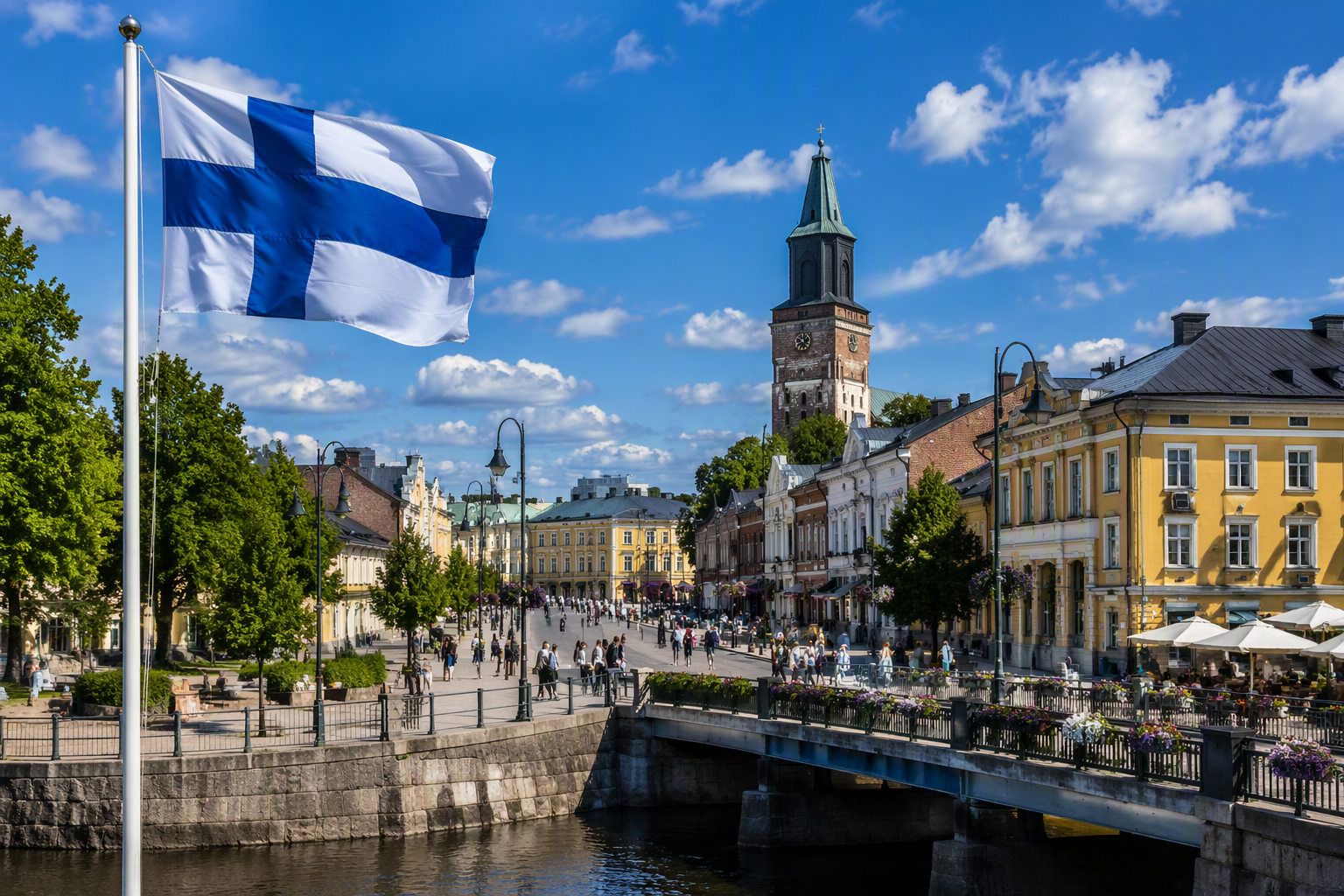 Finnish flag overlooking a historic city center in Finland with a river, bridge, and traditional architecture, showcasing Finnish culture and everyday life for learners preparing for the YKI test.
